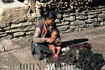 JWnepal20 : Tiberan woman anointing baby with oil, Tatopani, Nepal